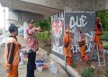 Pasukan Oranye Percantik Kolong Tol Becakayu